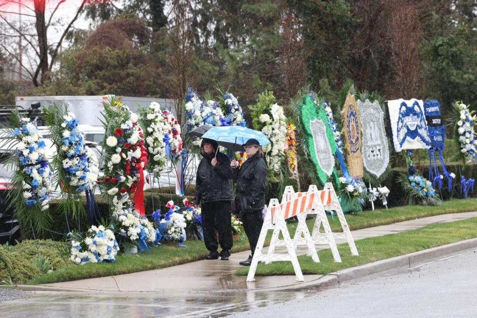 Mourners line up outside the Massapequa Funeral Home for the wake for Jonathan Diller. Dennis A. Clark