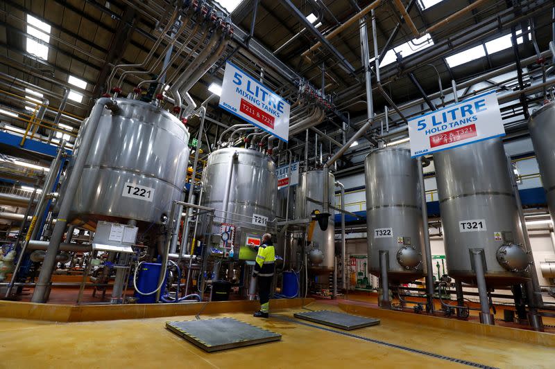 Ecolab employees on the filling line prepare the Skinman Soft Protect FF virucidal hand rub that is supplied to the NHS