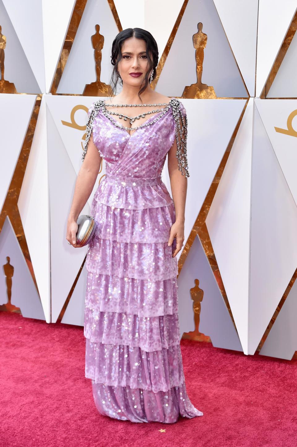 <p>Salma Hayek wears a purple ruffle statement dress. She shimmered on the carpet thanks to her lilac sequins.</p>