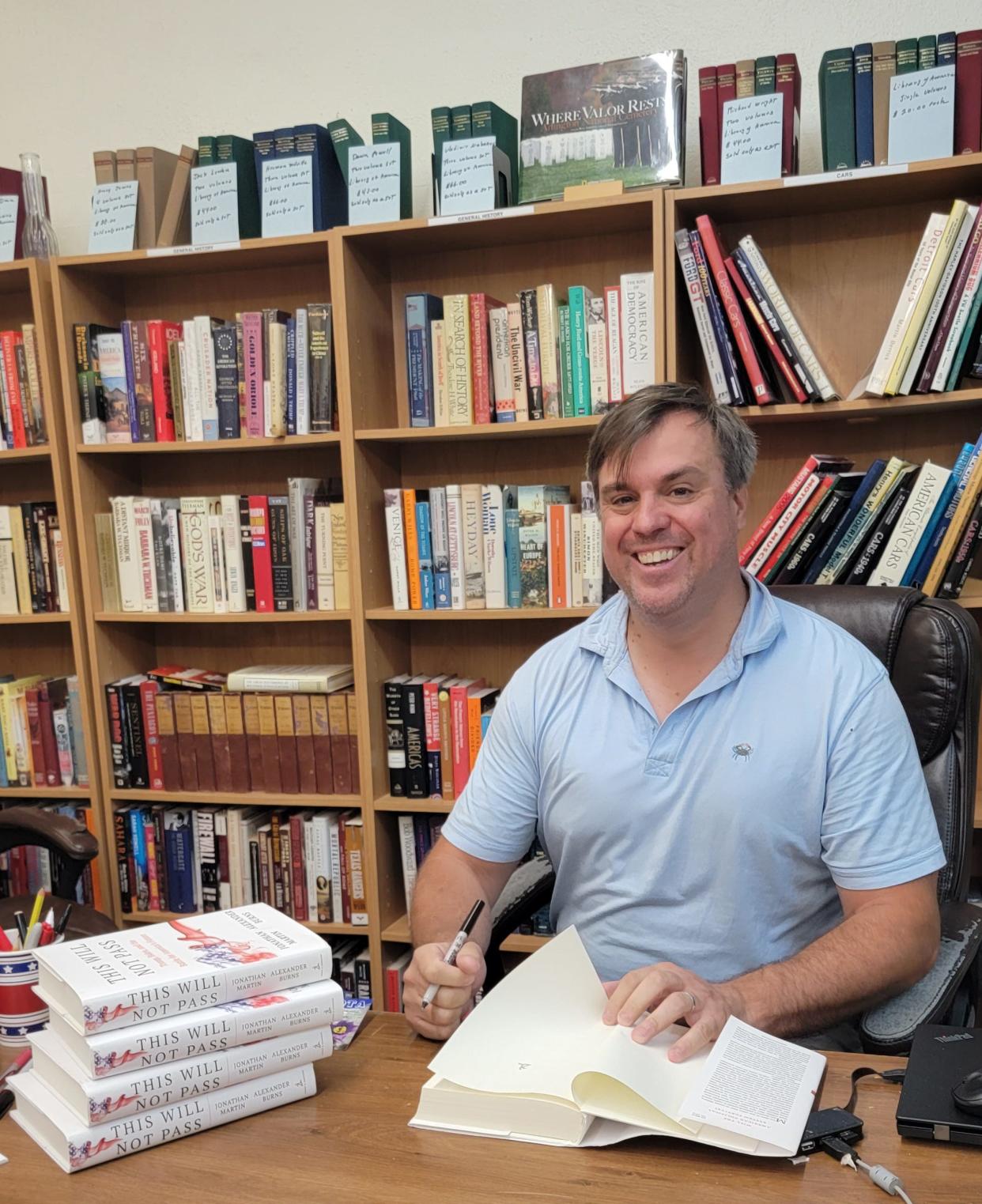 "This Will Not Pass" coauthor and The New York Times National Political Correspondent Jonathan Martin signs copies of his book in Watertown on Friday.