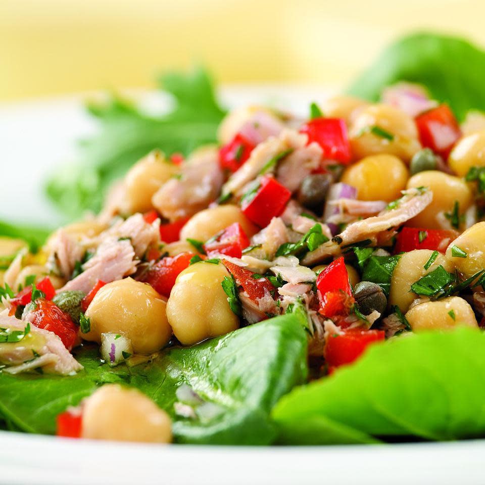 <p>Capers, red onion and fresh herbs give canned tuna and beans a light, fresh taste. Here we serve the tuna salad on a bed of greens. It also works well stuffed into a pita for a sandwich. Give it some extra kick with a pinch of crushed red pepper or cayenne. Serve with olive bread.</p>