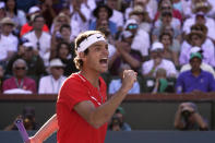 Taylor Fritz reacts after winning a game against Rafael Nadal, of Spain, during the men's singles finals at the BNP Paribas Open tennis tournament Sunday, March 20, 2022, in Indian Wells, Calif. (AP Photo/Mark J. Terrill)