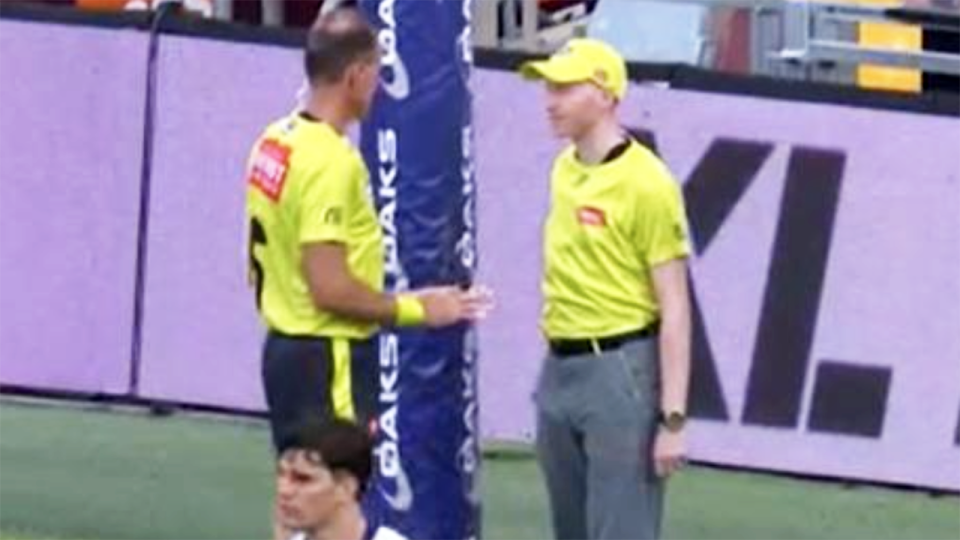 The umpires, pictured here conferring before calling a behind.