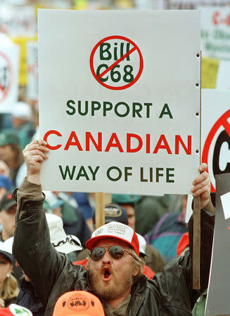 FILE PHOTO: A gun owner yells during a protest against the Federal Government's tough new gun law, C-68, on Parliament Hill in Ottawa, Ontario, Canada, September 22, 1998. REUTERS/Jim Young/File Photo