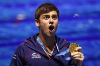 Diving – 17th FINA World Aquatics Championships – Men's 10m Platform awarding ceremony – Budapest, Hungary – July 22, 2017 – Tom Daley of Britain (gold) poses with the medal. REUTERS/David Balogh TPX IMAGE OF THE DAY