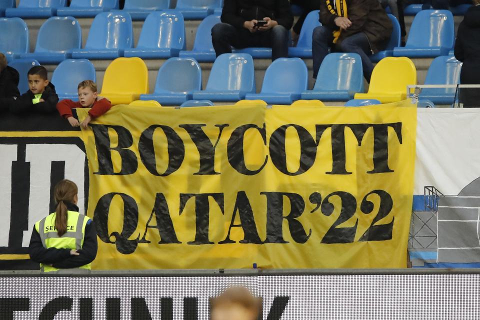 A banner held up calling for the boycott of the 2022 World Cup in Qatar.