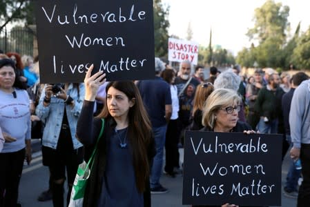 FILE PHOTO: People attend a public gathering in memory of the victims of a suspected serial killer, in Nicosia