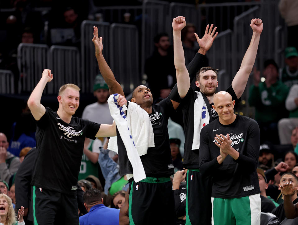 Boston, MA - May 1: Sam Hauser #30, Al Horford #42, Luke Kornet #40 and Jordan Walsh #27 of the Boston Celtics celebrate during the second half of Game 5 during the Eastern Conference First Round Playoffs at TD Garden .  (Photo by Matt Stone/MediaNews Group/Boston Herald via Getty Images)