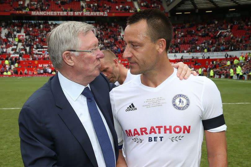 Sir Alex Ferguson shakes hands with John Terry after a charity match at Old Trafford.