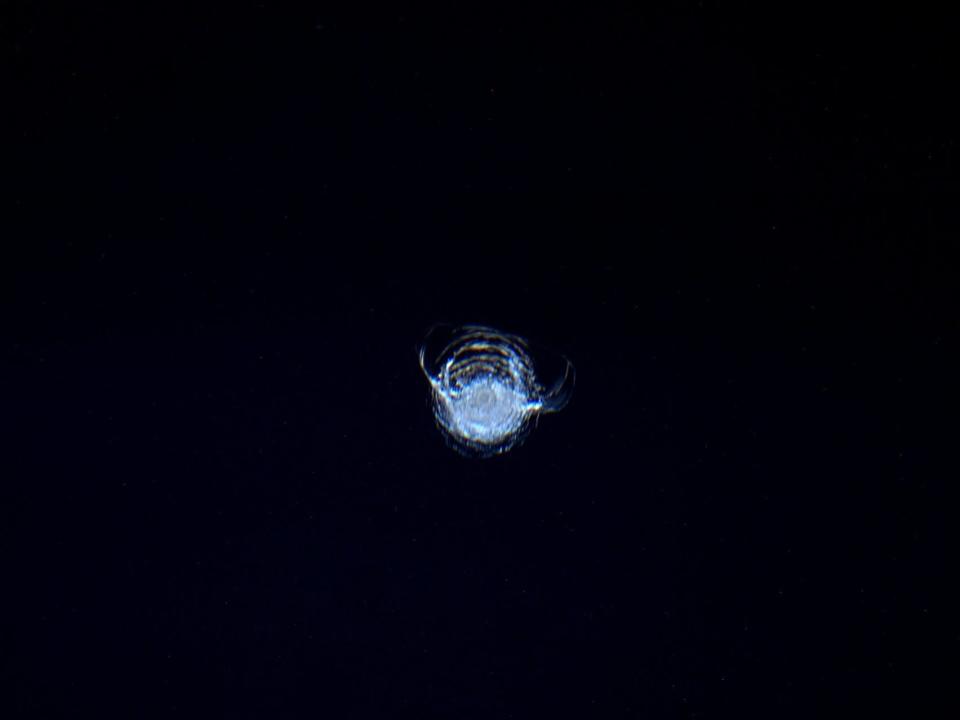 A chip in the ISS cupola taken by Astronaut Tim Peake is seen on a dark background