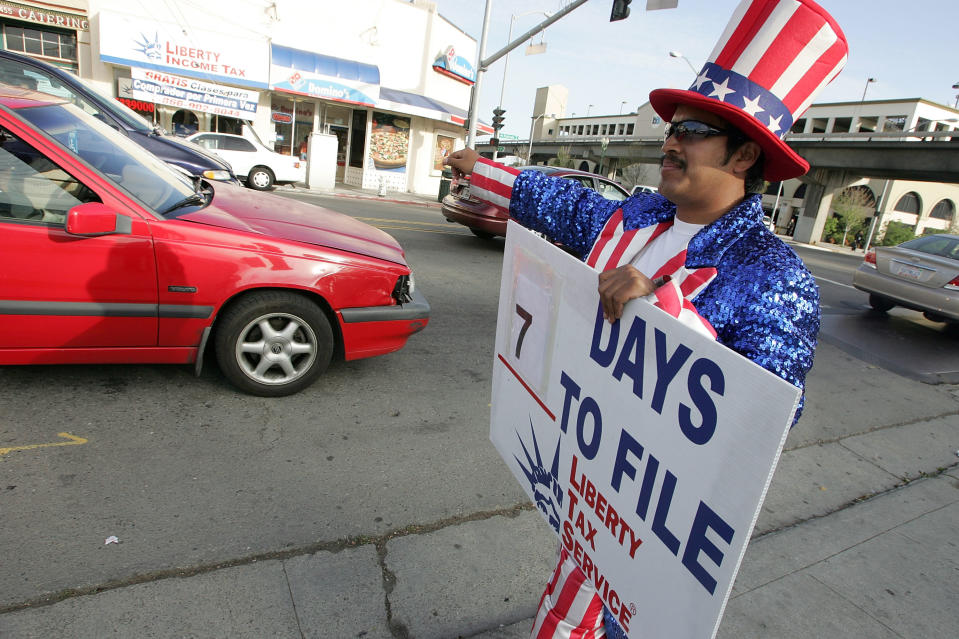 OAKLAND, CA - APRIL 10:  A worker with Liberty Tax Service wears an Uncle Sam costume as he tries to attract new business from people who need to file their taxes April 10, 2007 in Oakland, California. U.S. taxpayers are rushing to meet the Tuesday, April 17th deadline for filing their 2006 taxes.  (Photo by Justin Sullivan/Getty Images)