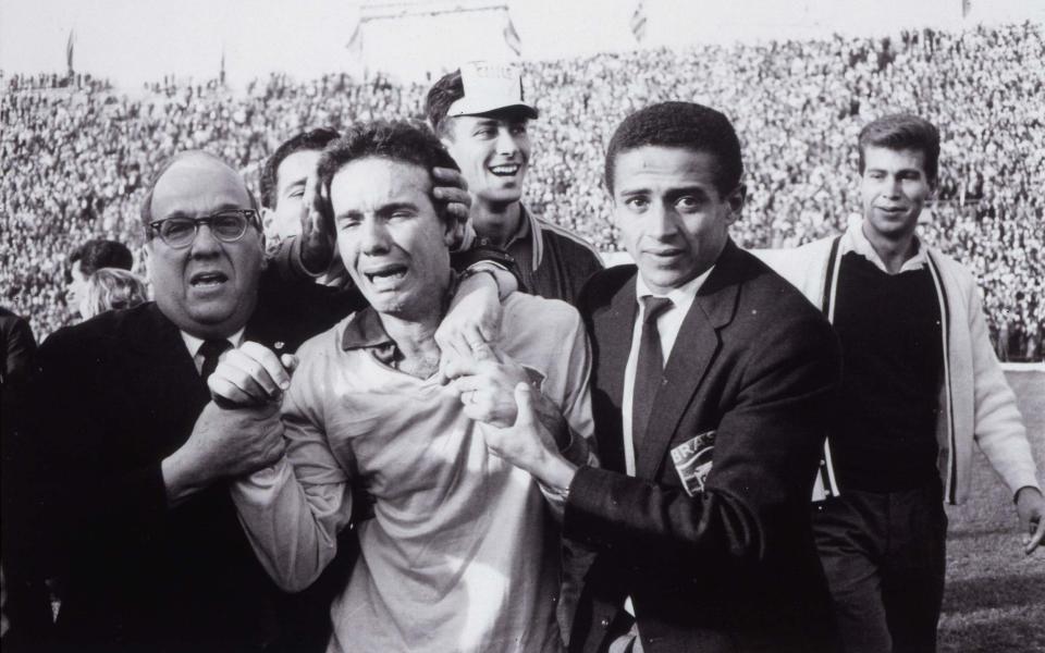 Zagallo is led off in tears after Brazil’s victory over Czechoslovakia in the 1962 World Cup final in Santiago, Chile