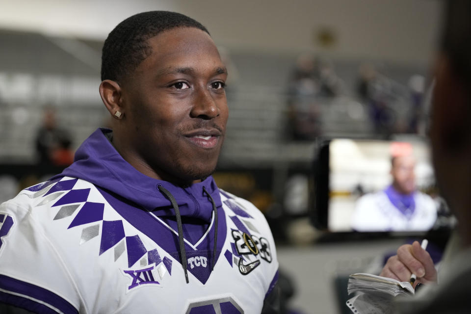 TCU running back Emari Demercado speaks to the media during a media day ahead of the national championship NCAA College Football Playoff game between Georgia and TCU, Saturday, Jan. 7, 2023, in Los Angeles. The championship football game will be played Monday. (AP Photo/Marcio Jose Sanchez)