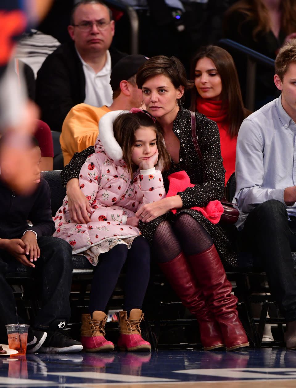 Suri Cruise and Katie Holmes attend the Oklahoma City Thunder Vs New York Knicks game at Madison Square Garden on December 16, 2017 in New York City.