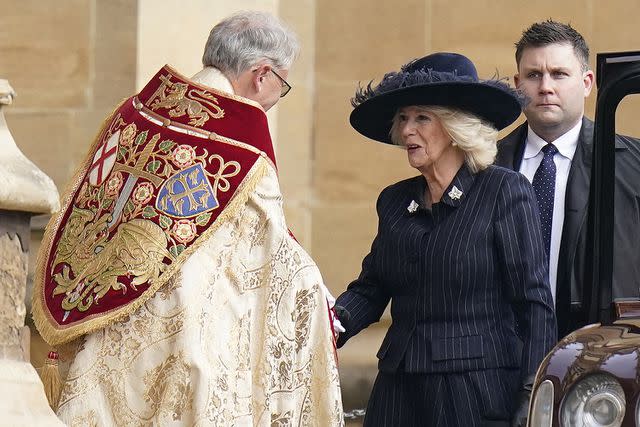 <p>ANDREW MATTHEWS/POOL/AFP via Getty Images</p> Queen Camilla arriving at the service at Windsor Castle on Tuesday, February 27