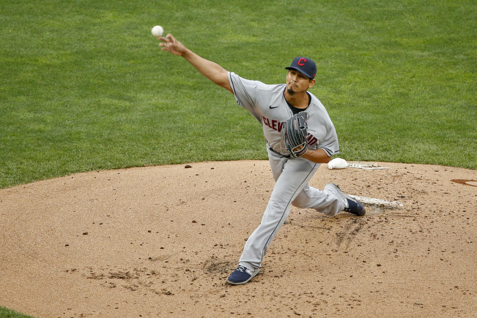 Cleveland Indians starting pitcher Carlos Carrasco throws to a Minnesota Twins batter during the first inning of a baseball game Saturday, Aug. 1, 2020, in Minneapolis. (AP Photo/Bruce Kluckhohn)