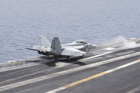 A U.S. Navy F/A-18E Super Hornet fighter jet launches from the flight deck of the aircraft carrier USS Harry S. Truman in the Mediterranean Sea in a photo released by the US Navy June 3, 2016. U.S. Navy/Mass Communication Specialist 3rd Class Bobby J Siens/Handout via REUTERS