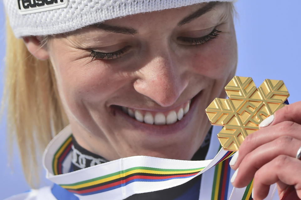 Switzerland's Lara Gut-Behrami eyes her gold medal after a women's giant slalom, at the alpine ski World Championships, in Cortina d'Ampezzo, Italy, Thursday, Feb. 18, 2021. (AP Photo/Marco Tacca)