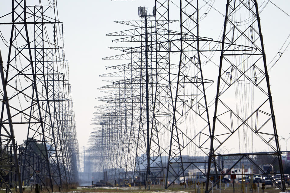 Power lines are shown Tuesday, Feb. 16, 2021, in Houston. More than 4 million people in Texas still had no power a full day after historic snowfall and single-digit temperatures created a surge of demand for electricity to warm up homes unaccustomed to such extreme lows, buckling the state's power grid and causing widespread blackouts. (AP Photo/David J. Phillip)