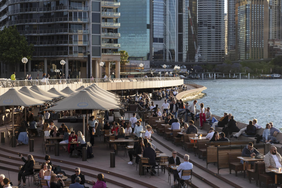 SYDNEY, AUSTRALIA - OCTOBER 16: People gather at the Opera Bar as hospitality re-opens on October 16, 2021 in Sydney, Australia. COVID-19 restrictions eased across NSW on Monday 11 October for fully vaccinated residents after the state passed its 70 per cent double vaccination target. Under the state government's Reopening NSW Roadmap, hospitality, retail stores, gyms and hairdressers can reopen, along with indoor entertainment venues, cinemas, theatres, museums and galleries. Restrictions will ease further in NSW once the state reaches its next vaccination milestone of 80 per cent of people having received two doses of a COVID-19 vaccine. (Photo by Brook Mitchell/Getty Images)