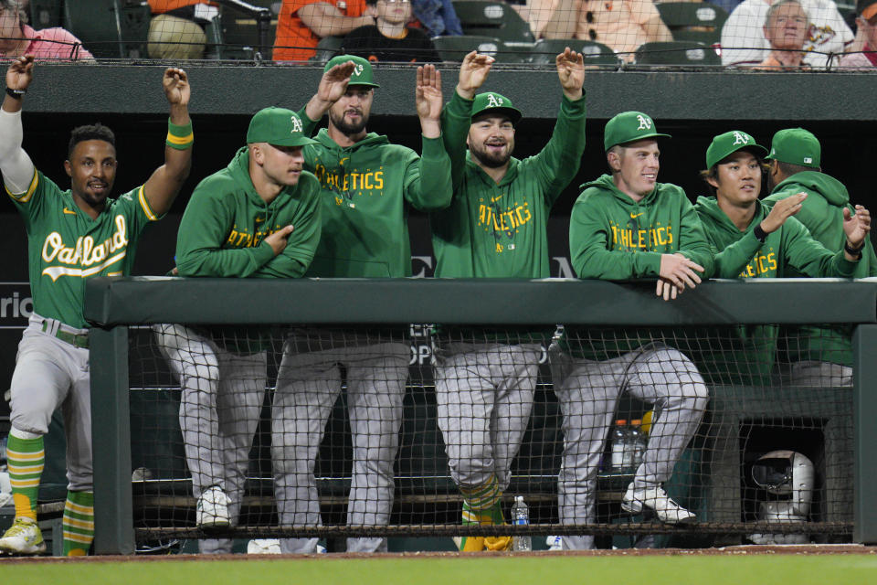 Oakland Athletics players gesture after Esteury Ruiz hit a single against the Baltimore Orioles during the ninth inning of a baseball game Wednesday, April 12, 2023, in Baltimore. The Athletics won 8-4. (AP Photo/Jess Rapfogel)