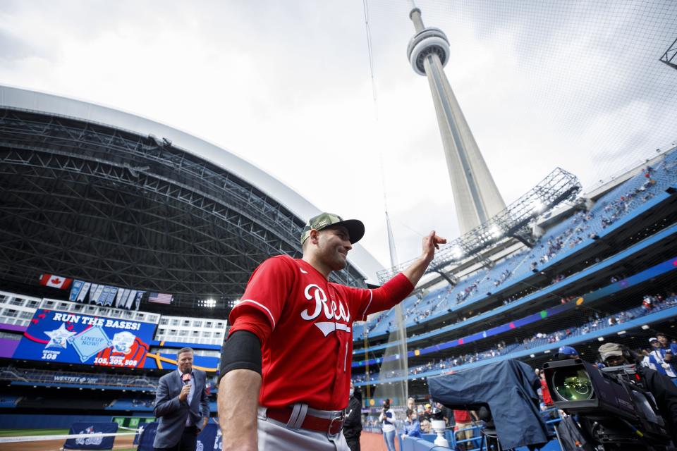 TORONTO, ON - MAY 22: Joey Votto of the Cincinnati Reds waves as he leaves the field following their MLB game victory over the Toronto Blue Jays at Rogers Centre on May 22, 2022 in Toronto, Canada.