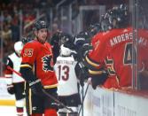 Nov 25, 2018; Glendale, AZ, USA; Calgary Flames center Sean Monahan celebrates with teammates after scoring a goal against the Arizona Coyotes in the first period at Gila River Arena. Mandatory Credit: Mark J. Rebilas-USA TODAY Sports