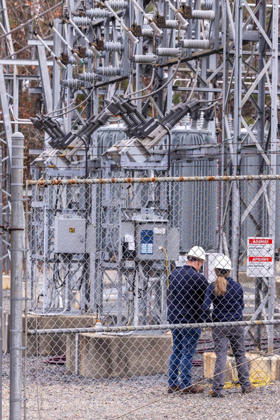Workers with Randolph Electric Membership Corporation work to repair the Eastwood Substation in West End Tuesday, Dec. 6, 2022. Two deliberate attacks on electrical substations in Moore County Saturday evening caused days-long power outages for tens of thousands of customers.