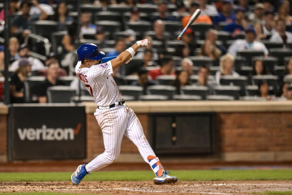 Aug 12, 2023; New York City, New York, USA; New York Mets third baseman Mark Vientos (27) loses his bat while swinging during the fourth inning against the Atlanta Braves at Citi Field. Mandatory Credit: John Jones-USA TODAY Sports