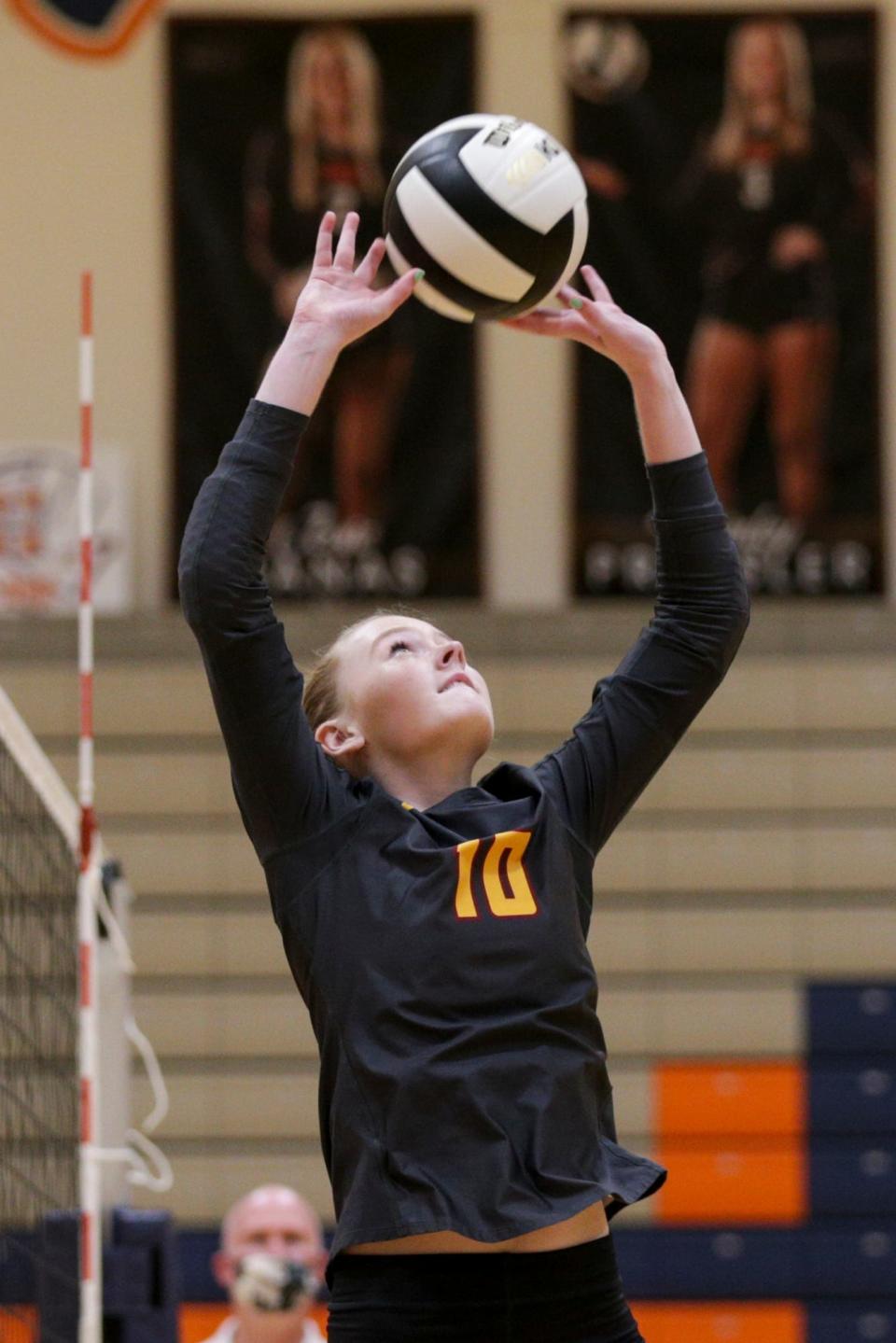 McCutcheon's Allie Shondell (10) sets the ball during the first set of an IHSAA volleyball game, Thursday, Sept. 16, 2021 in West Lafayette.
