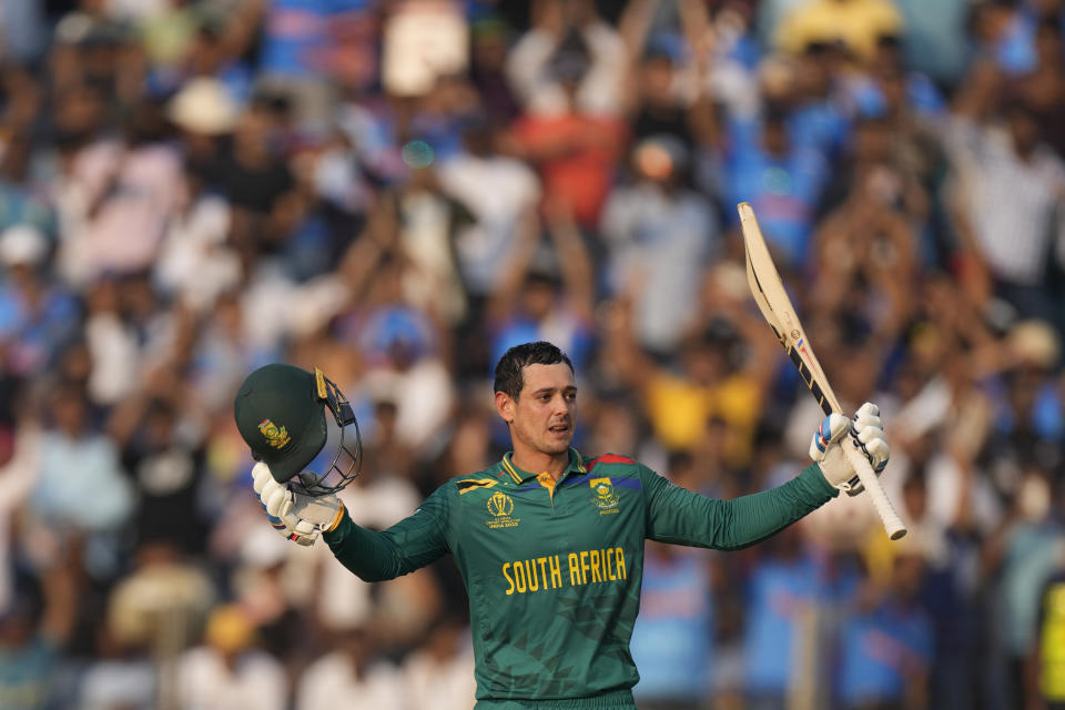 South Africa's Quinton De Kock celebrates his century during the ICC Men's Cricket World Cup match between New Zealand and South Africa in Pune, India, Wednesday, Nov.1, 2023. (AP Photo/Manish Swarup)