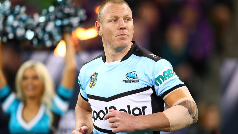 Luke Lewis runs onto the field for his final game. (Photo by Mark Kolbe/Getty Images)