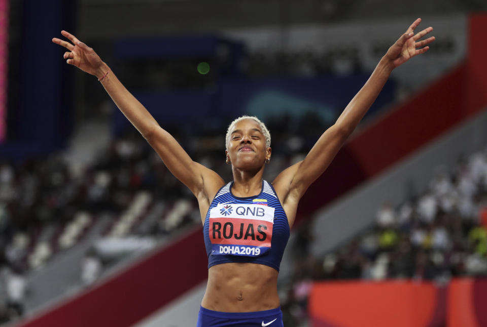 Yulimar Rojas, of Venezuela, triple jump gold winner, celebrates at the World Athletics Championships in Doha, Qatar, Saturday, Oct. 5, 2019. (AP Photo/Hassan Ammar)