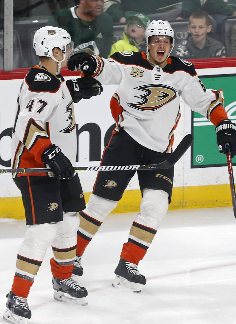 Anaheim Ducks' Hampus Lindholm, left, and Rickard Rakell, of Sweden, celebrate Rakell's goal off Minnesota Wild goalie Alex Stalock in the first period of an NHL hockey game, Thursday, Jan. 17, 2019, in St. Paul, Minn. (AP Photo/Jim Mone)