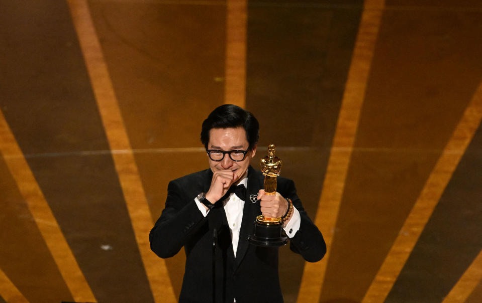 Ke Huy Quan accepts the Oscar for Best Actor in a Supporting Role for "Everything Everywhere All at Once" onstage during the 95th Annual Academy Awards.<span class="copyright">Patrick T. Fallon—AFP/Getty Images</span>