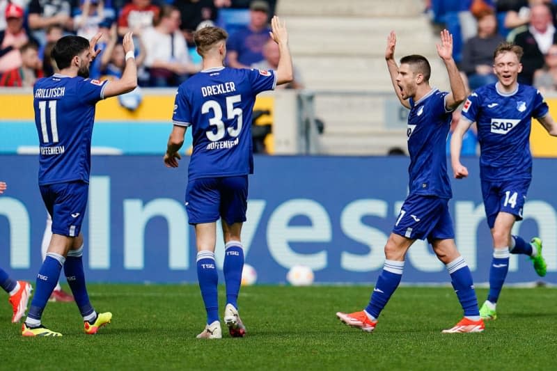 Hoffenheim Andrej Kramaric (2nd R) celebrates scoring his side's second goal with teammates during the German Bundesliga soccer match between TSG 1899 Hoffenheim and FC Augsburg at the PreZero Arena. Uwe Anspach/dpa