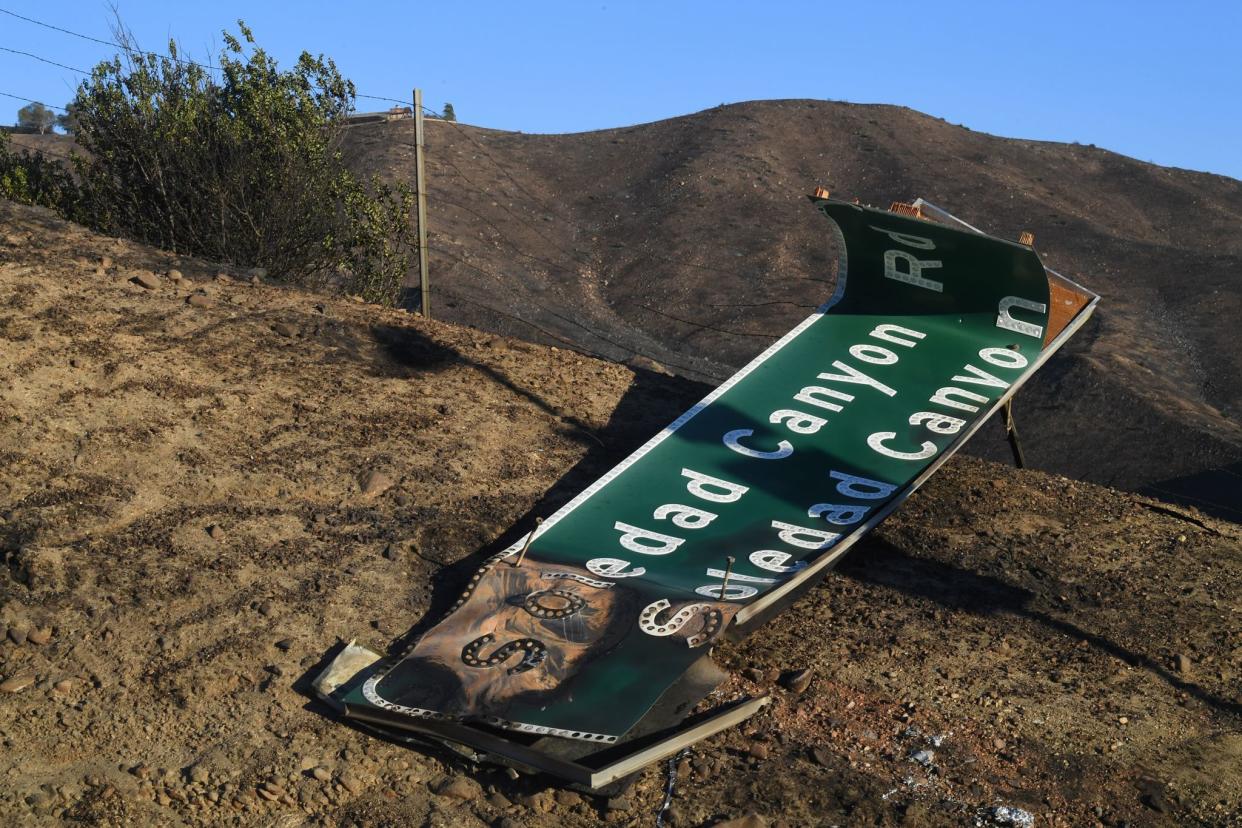 Fire damage to the Highway 14 during the Tick Fire in Agua Dulce near Santa Clarita, California on October 25, 2019. - California firefighters battled through the night to contain a fast-moving wildfire driven by high winds that was threatening to engulf thousands of buildings. Around 40,000 people were told to flee the Tick Fire, which was raging across 4,000 acres (1,600 hectares) just north of Los Angeles. (Photo by Mark RALSTON / AFP) (Photo by MARK RALSTON/AFP via Getty Images)