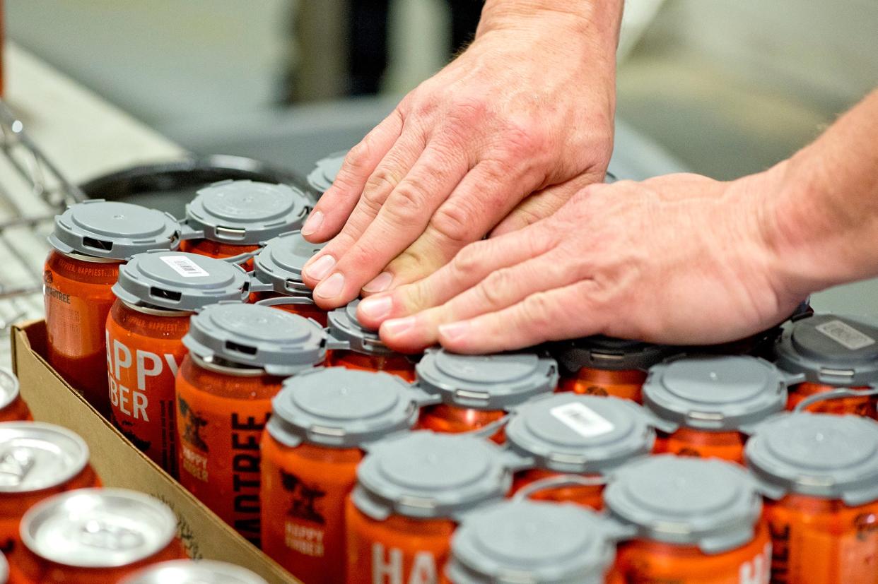 Freshly canned Happy Amber beer.