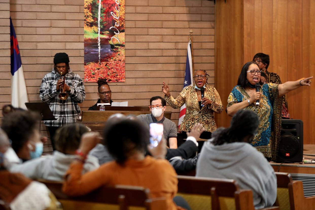 Cheryl Thomas-Lewis, right, leads the musical selections during an event to honor Dr. Martin Luther King Jr. at First Community Baptist Church in Desert Hot Springs, Calif., on Monday, Jan. 17, 2022.
