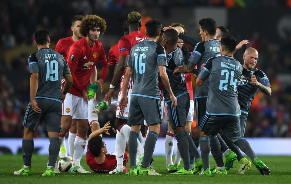 <p>Players from both sides clash in the build up to Eric Bailly of Manchester United and Facundo Roncaglia of Celta Vigo being shown a red card during the UEFA Europa League, semi final second leg match, between Manchester United and Celta Vigo at Old Trafford </p>