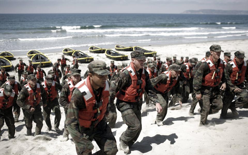 A group of US Navy Seal trainees during Hell Week at a beach in Coronado, California - Charles Ommanney/Getty