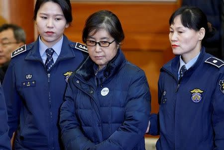 FILE PHOTO: Choi Soon-sil, the woman at the centre of the South Korean political scandal and long-time friend of President Park Geun-hye, arrives for a hearing arguments for South Korean President Park Geun-hye's impeachment trial at the Constitutional Court in Seoul, South Korea, January 16, 2017. REUTERS/Kim Hong-Ji/File Photo