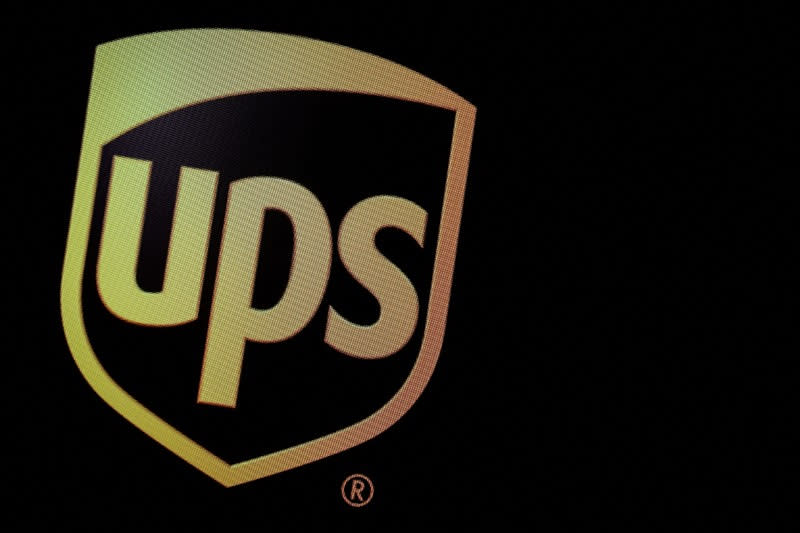 FILE PHOTO: The company logo for United Parcel Service (UPS), is displayed on a screen at the NYSE in New York