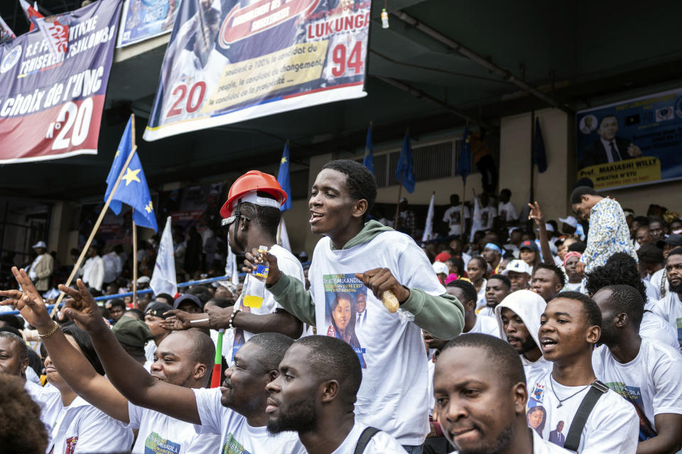 Supporters of president Felix Tshisekedi gather in a stadium to attend a campaign rally ahead of the presidential elections, in Kinshasa, Democratic Republic of the Congo, Sunday, Nov. 19, 2023. (AP Photo/Samy Ntumba Shambuyi)