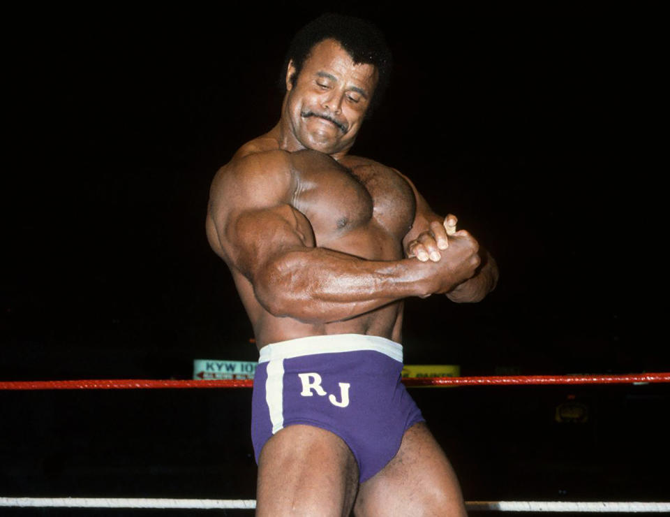 In this undated photo provided by WWE, Inc., Rocky "Soul Man" Johnson poses in the ring. Johnson, a WWE Hall of Fame wrestler who became better known as the father of actor Dwayne “The Rock” Johnson, died Wednesday, Jan. 15, 2020. He was 75. (WWE, Inc. via AP)