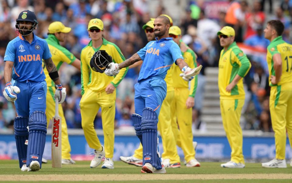 Shikhar Dhawan of India celebrates reaching his century during the ICC Cricket World Cup Group Match between India and Australia at the Kia Oval on June 9, 2019 in London, England. - Philip Brown/Popperfoto