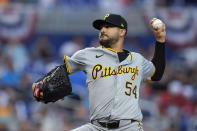 Pittsburgh Pirates' Martin Perez delivers a pitch during the first inning of a baseball game against the Miami Marlins, Friday, March 29, 2024, in Miami. (AP Photo/Wilfredo Lee)