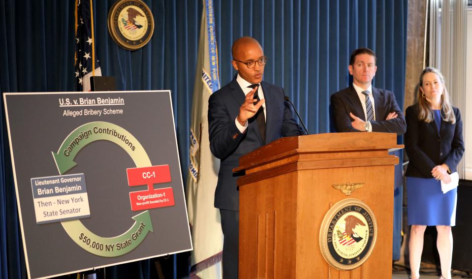 U.S Attorney for the Southern District of New York Damian Williams, displays a graphic outlining the federal conspiracy charges against New York Lt. Governor Brian Benjamin during a press conference in New York, April 12, 2022. Also pictured are Michael Driscoll from the FBI and Jocelyn Strauber, the NYC Commissioner for the Department of Investigations. 