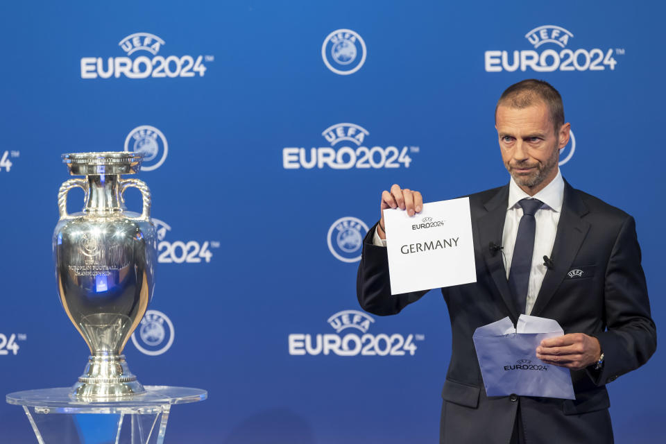 FILE - UEFA president Aleksander Ceferin, announces that Germany will stage the 2024 European Championships, during the Euro 2024 Host Announcement Ceremony, at the UEFA Executive Committee at the UEFA Headquarters, in Nyon, Switzerland, Thursday, September 27, 2018. UEFA has a two-step financial mission to refill its pandemic-hit cash reserves. It starts with a men’s 2024 European Championship held in the home of the continent’s largest economy. (Martial Trezzini/Keystone via AP, File)