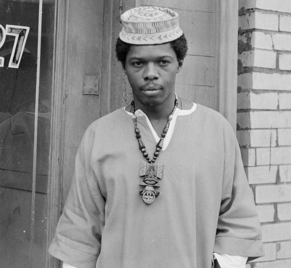 Portrait of Sala Udin (Sam Howze) wearing Anhk necklace and kufi, standing near doorway, Hill District, Pittsburgh, Pa., 1970. (Photo: Charles 'Teenie' Harris/Carnegie Museum of Art/Getty Images)